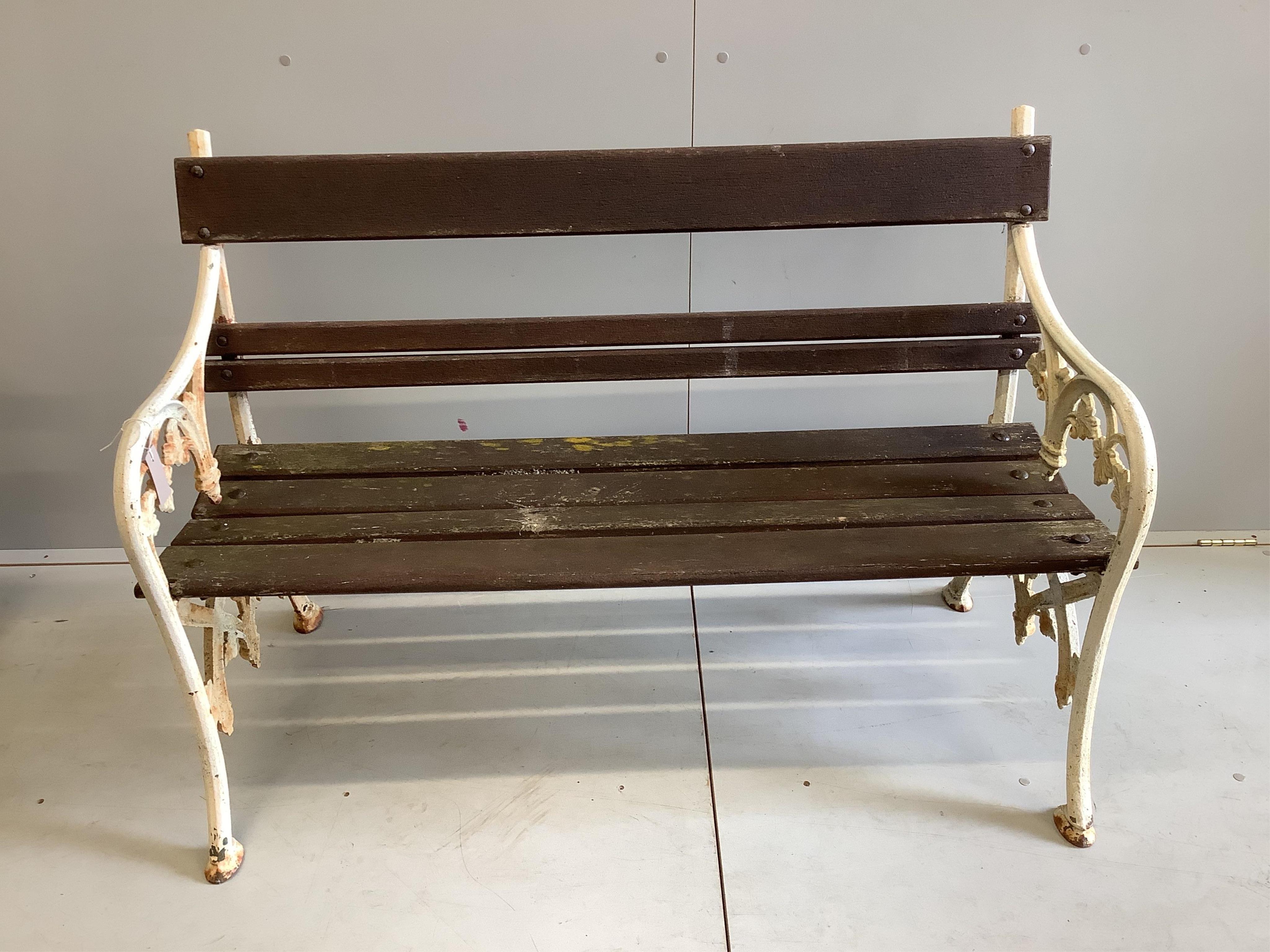 A Victorian style slatted cast iron garden bench, width 123cm, depth 58cm, height 86cm. Condition - fair